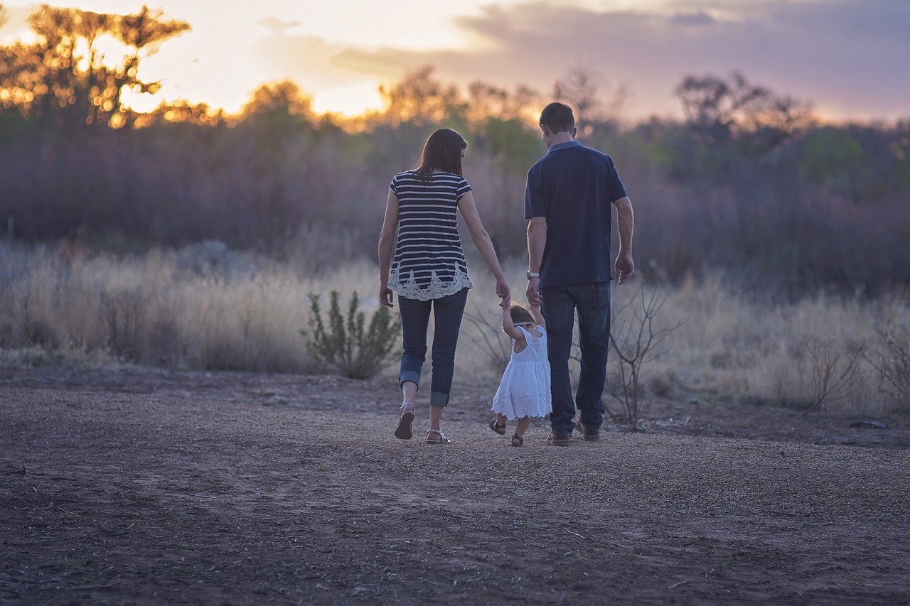 family walking countryside sunset 2485714